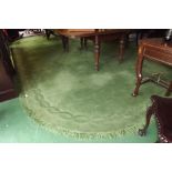 Large green wool rug. {  630 cm Long 356