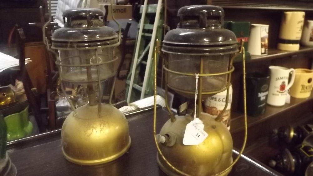 Two brass and metal Tilley lamps.