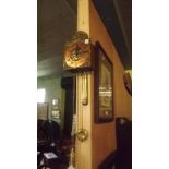 Brass and copper hanging wall clock.