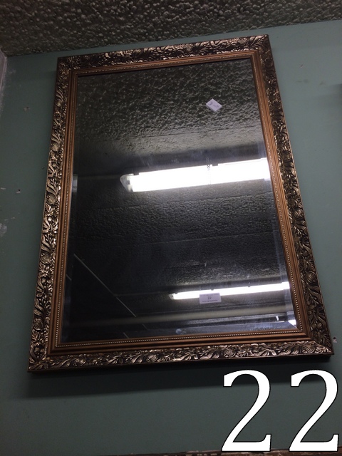 Modern bevelled edged mirror mounted in