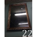 Modern bevelled edged mirror mounted in