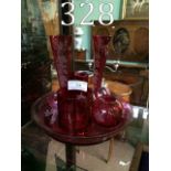 Six pieces of ruby glass vases etc.