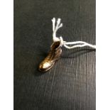 9ct. Gold charm in the form of a boot. 0
