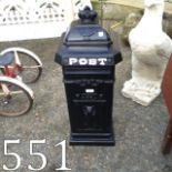 Cast iron post box.