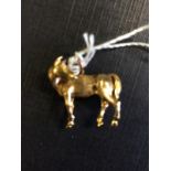 9ct. Gold charm in the form of a horse.
