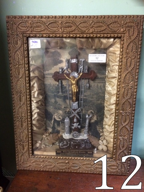 Religious icon mounted in a glazed case.