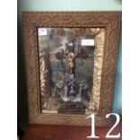 Religious icon mounted in a glazed case.