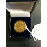 9ct. Gold ring with an 1899 gold half so
