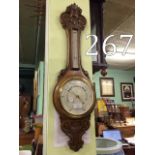 Victorian carved oak barometer.