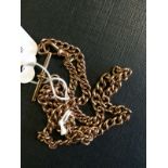 9ct. Rose gold watch chain with T - bar.