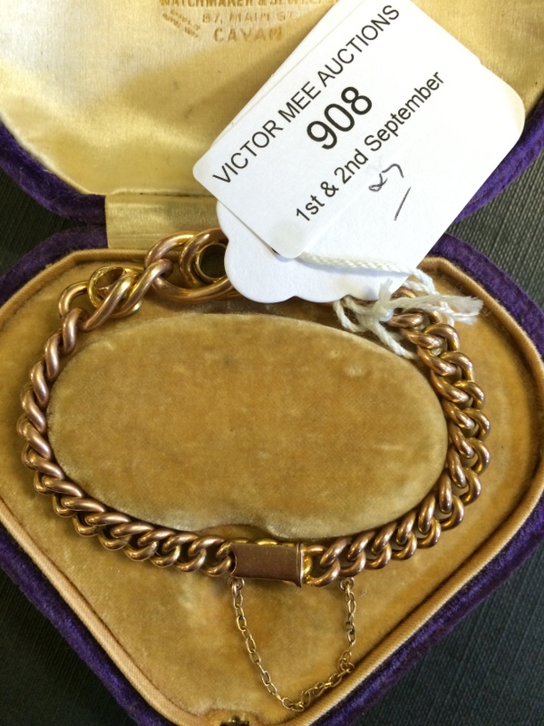 9ct. Gold link bracelet set with three p