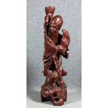 Scultura in legno esotico raff. ''PERSONAGGIO''. Cina. Fine XIX secolo. Mis. Alt. cm. 85  ca.