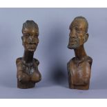 Due sculture in legno raff. "BUSTI DI PERSONAGGI TRIBALI". Africa. Mis. Alt. cm. 43  ca.