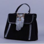 LULU GUINNESS. Handbag in velluto rigato nero decorato con guanto in pelle. Mis. Lung. cm. 27 Alt.