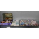 FOUR SMALL CASES OF MINIATURE DOLLS INCL