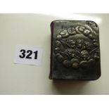 MINIATURE COMMON PRAYER BOOK WITH CHERUB EMBOSSED HM SILVER FRONT COVER ON BURGUNDY LEATHER