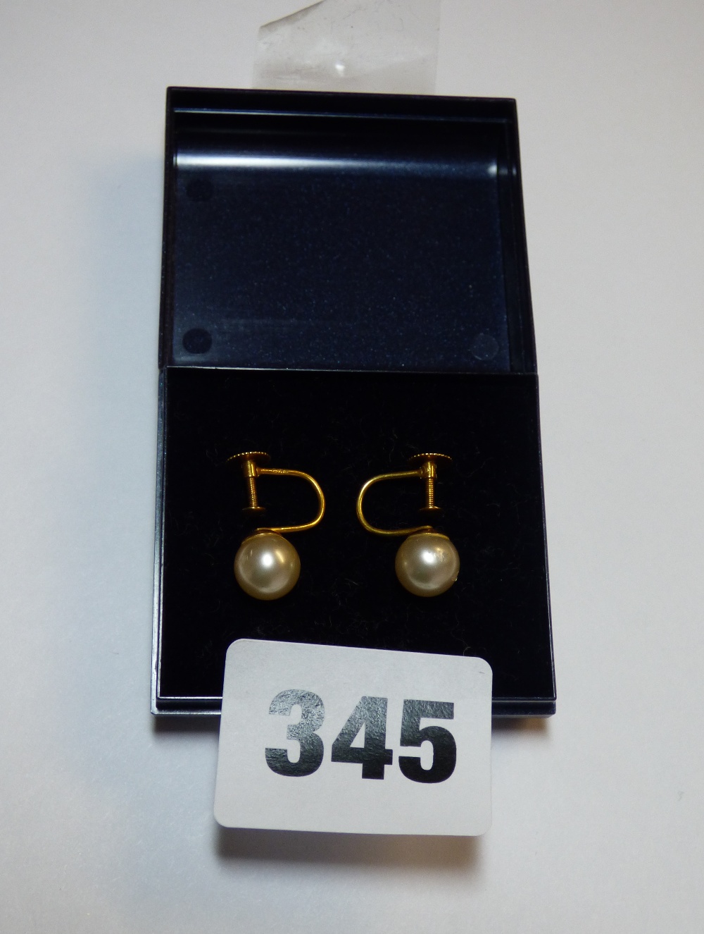 A PAIR OF 9CT GOLD SCREW BACK SIMULATED PEARL EARRINGS