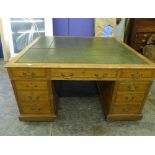 EDWARDIAN OAK PEDESTAL PARTNERS DESK WITH PANELED SIDES AND GREEN LEATHER INSET TOP 77CM X 60CM X