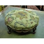 VICTORIAN UPHOLSTERED MOULDED FRAMED CONVEX FOOTSTOOL ON SCROLL FEET