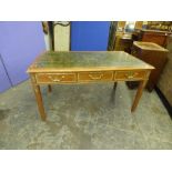 20TH CENTURY MAHOGANY FRENCH EMPIRE STYLE WRITING TABLE HAVING GILT METAL MOUNTS AND INSET TOOLED