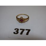 UNMARKED YELLOW METAL DIAMOND AND RUBY CROSS SET RING SIZE R 2.