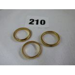 THREE 9CT YELLOW GOLD WEDDING BANDS 6.