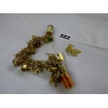 9CT GOLD LINK CHARM BRACELET WITH SAFETY CHAIN AND NUMBER OF CHARMS AND 3 LOOSE CHARMS 62G APPROX