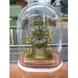 BRASS FRETWORK SKELETON CLOCK WITH SPREAD EAGLE AND LION ORNAMENTATION UNDER DOME ON A MARBLE