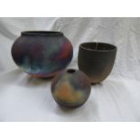 FUMED RAKU FIRED GLOBULAR VASE, A OVOID VASE AND A LARGER OVOID VASE 17.