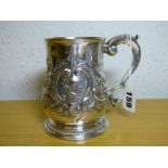 HM LONDON SILVER BALUSTER TANKARD WITH LEAF CAPPED SCROLL HANDLE EMBOSSED WITH FOLIAGE AND AN