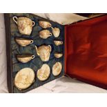 EARLY 20TH CENTURY WOODEN PRESENTATION CASED JAPANESE EARTHENWARE SATSUMA TEASET WITH PRUNUS