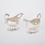 PAIR OF GEORGE III SILVER SAUCE BOATS, LONDON, 1800 of plain oval bellied form with leaf-capped