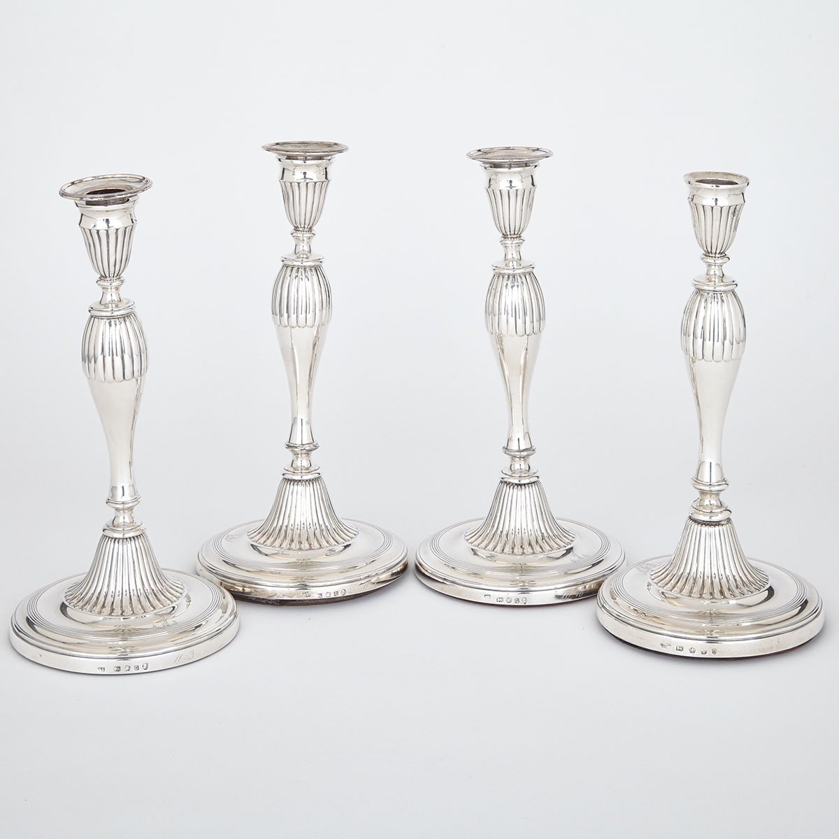 SET OF FOUR GEORGE III SILVER TABLE CANDLESTICKS, SHEFFIELD, 1795/98 with bands of flutes and reeded