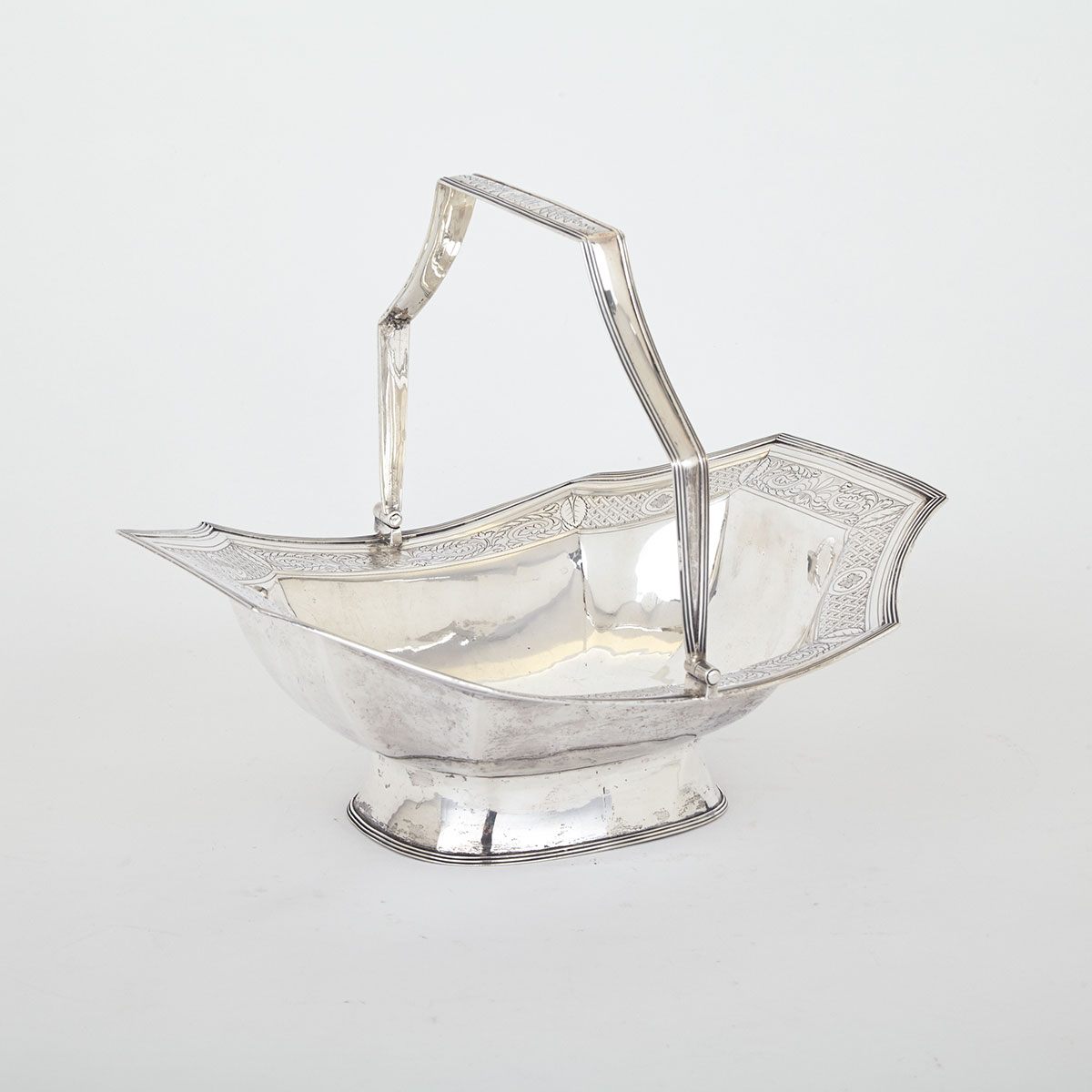 GEORGE III SILVER CAKE BASKET, DUNCAN URQUHART & NAPTHALI HART, LONDON, 1808 of octagonal form,