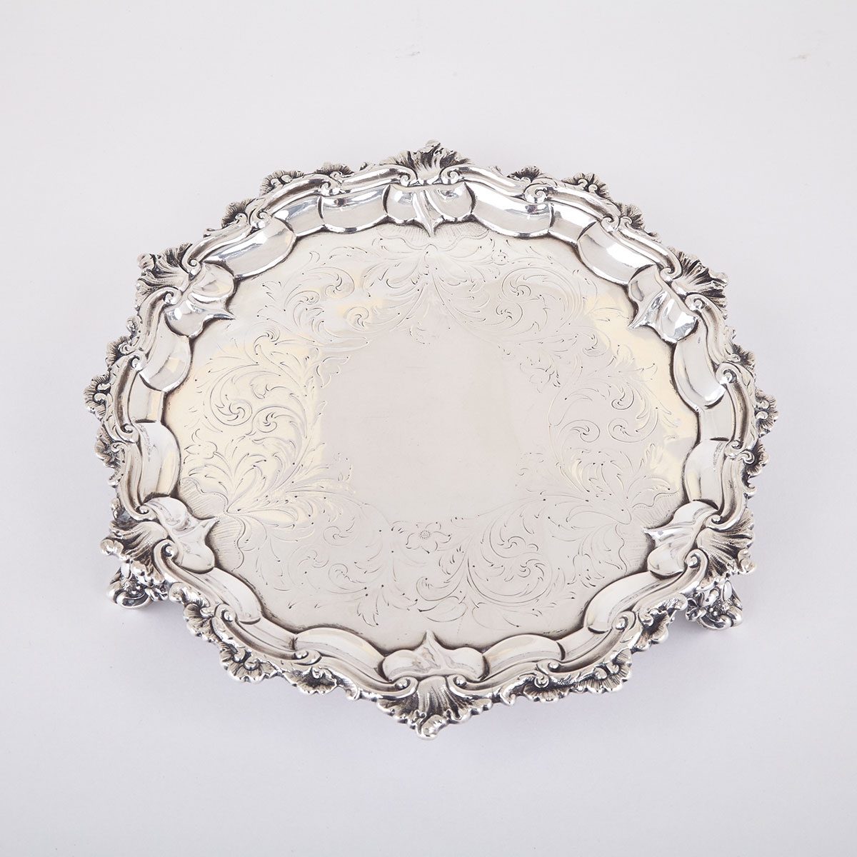 VICTORIAN SILVER CIRCULAR SALVER, JOHN WELLBY, LONDON, 1838 with moulded shell and scroll rim on