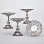 SET OF FOUR VICTORIAN SILVER DESSERT STANDS, ROBERT GARRARD, LONDON, 1875 of shaped circular form,