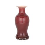 A CHINESE COPPER RED-GLAZED BALUSTER VASE, 18TH/19TH CENTURY 18/19世紀 郎窯紅觀音瓶  Copper-red glaze