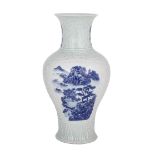 CELADON GROUND BLUE AND WHITE VASE, 19TH/20TH CENTURY 19/20世紀 粉青釉模印青花山水瓶  The vase moulded with