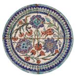 A RARE CIRCULAR PANEL OF FOUR POLYCHROME IZNIK TILES, TURKEY, 16TH/17TH CENTURY 十六/十七世紀 伊兹尼克磁磚