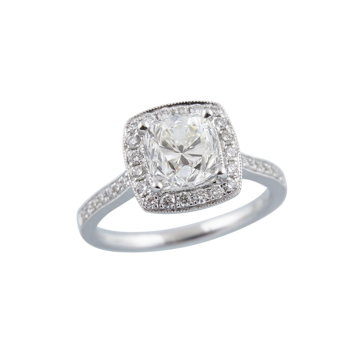 18K WHITE GOLD RINGset with a cushion cut diamond (approx. 2.19ct.) in a mount decorated with 36