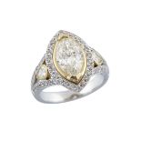 18K WHITE AND YELLOW GOLD RINGset with a marquis cut diamond (2.17ct.) in a mount decorated with 2