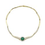 JOSE HESS 18K YELLOW GOLD NECKLACEset with an oval cut emerald (approx. 4.75ct.) and decorated