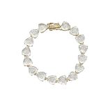 14K YELLOW GOLD BRACELETset with 16 hollowed heart cut white topaz, each containing 3 small roving