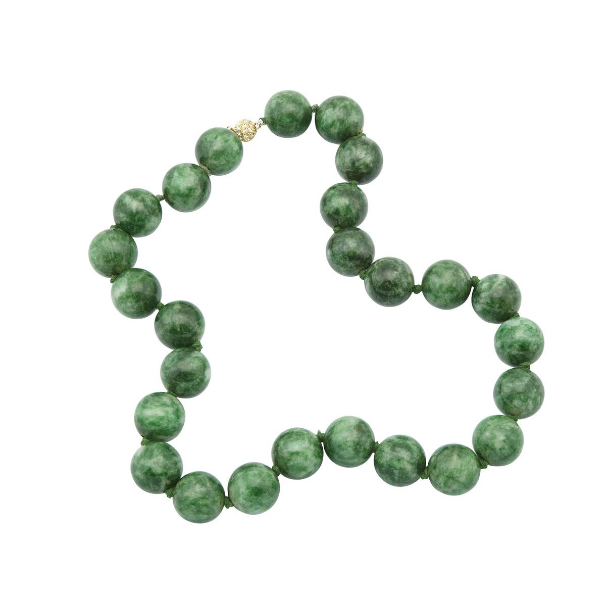 SINGLE STRAND OF LARGE JADEITE BEADScomposed of 26 beads (24.0mm to 25.0mm) and completed with a