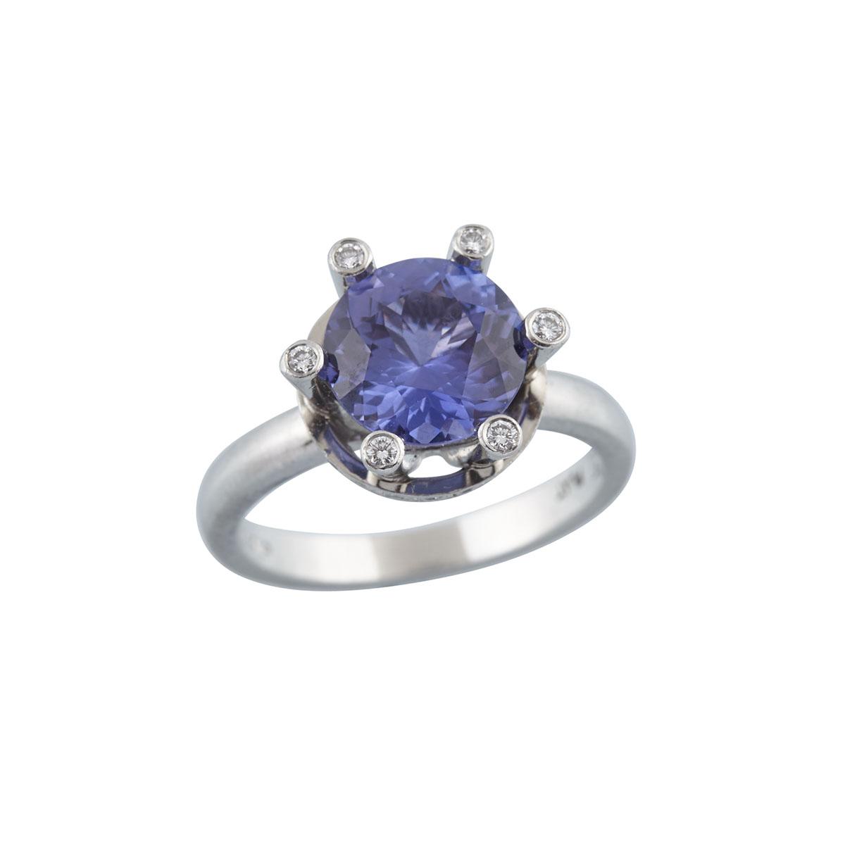 J.VAIR PLATINUM RINGset with a full cut purple sapphire (approx. 2.90ct.) in a mount decorated