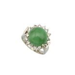 14K WHITE GOLD RINGset with a circular jadeite cabochon (12.6mm) encircled by 16 brilliant cut