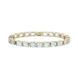 9K YELLOW GOLD BRACELETset with a line of 21 emerald cut aquamarines (approx. 30.0ct.t.w.)length 7.