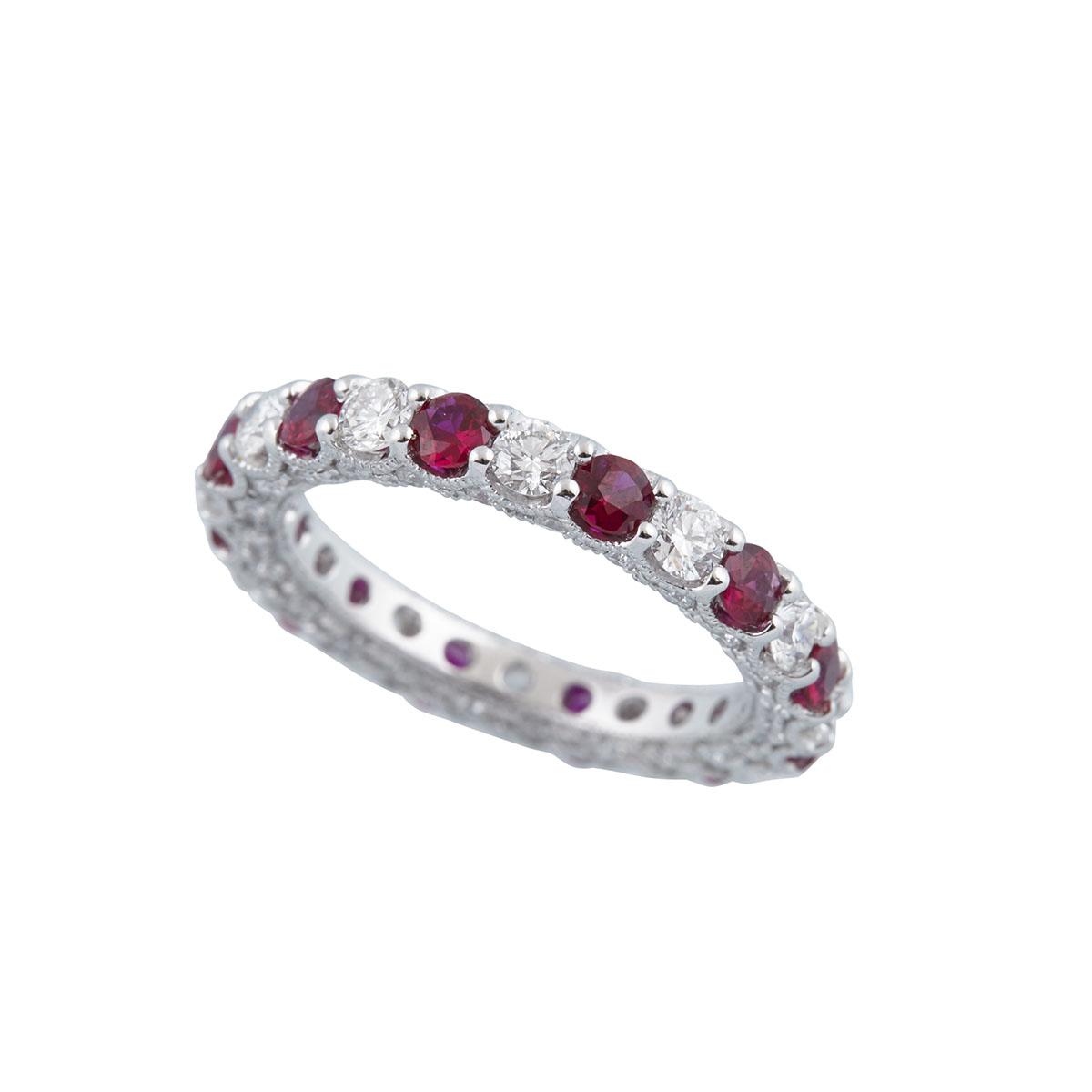 18K WHITE GOLD FILIGREE ETERNITY BANDset with 12 full cut rubies (approx. 1.13ct.t.w.), 12 brilliant