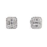 PAIR OF 18K WHITE GOLD STUD EARRINGSeach set with 5 baguette cut and 26 brilliant cut diamonds (