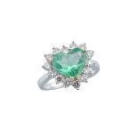18K WHITE AND YELLOW GOLD RINGset with a heart cut emerald (approx. 2.04ct.) encircled by 14